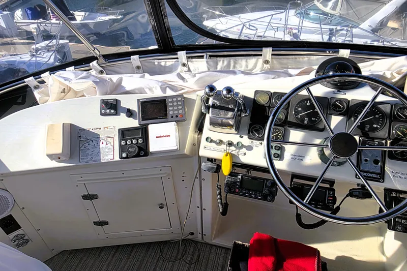 Slide: The Image of Cockpit of 1990 Californian 48 Cockpit Motor Yacht with steering wheel and navigation instruments. - 8