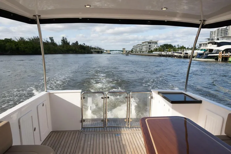 Slide: The Image of 2026 Hylas M49 yacht cruising on a scenic waterway with modern interior. - 10