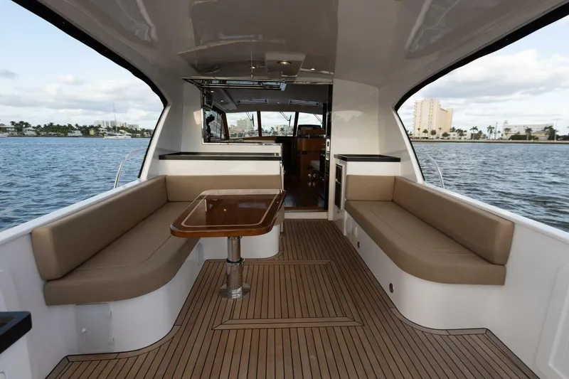 Slide: The Image of Luxurious 2026 Hylas M49 yacht interior with elegant seating and wooden flooring. - 14