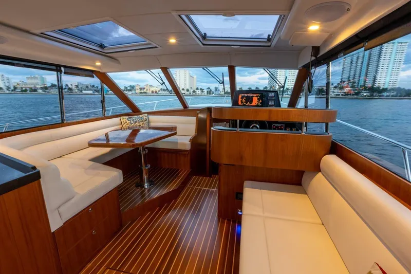Slide: The Image of Luxurious interior of 2026 Hylas M49 yacht with elegant wood finish and waterfront view. - 17