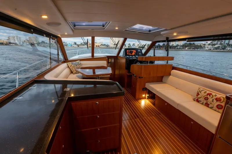 Slide: The Image of Luxurious interior of 2026 Hylas M49 yacht with elegant wood finishes and waterfront view. - 18