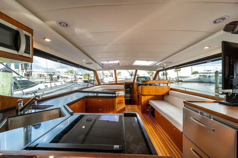 Slide: The Image of Luxurious interior of 2026 Hylas M49 yacht with modern kitchen and seating area. - 21