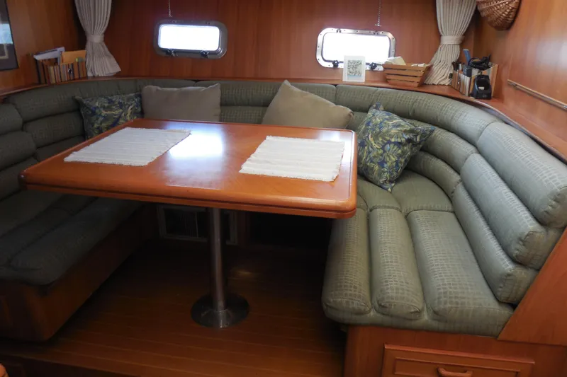 Slide: The Image of Dinnette across from galley down seats six comfortably. - 16