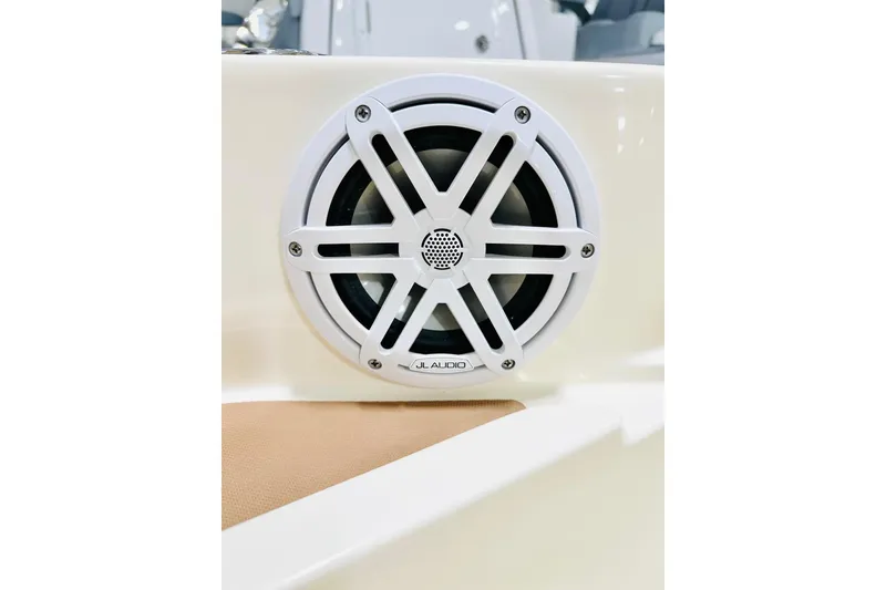 Slide: The Image of JL Audio speaker on 2026 Scout 231 XSB boat, white grille design. - 13