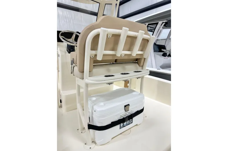 Slide: The Image of 2026 Scout 231 XSB boat interior with seating and cooler storage. - 6