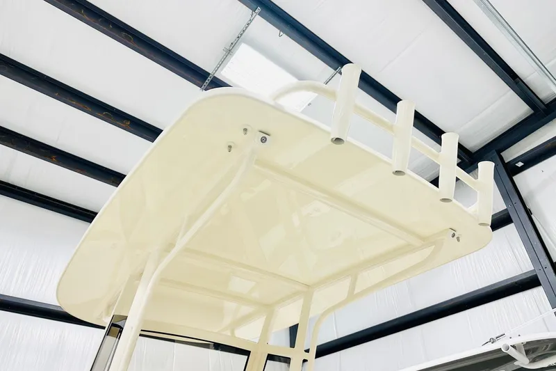 Slide: The Image of 2026 Scout 231 XSB boat top view in a modern indoor facility. - 7