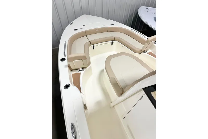 Slide: The Image of 2026 Scout 231 XSB boat interior with beige seating and sleek design. - 8