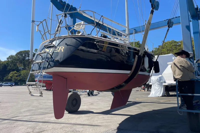 Slide: The Image of 1989 Sabre 30 MKIII sailboat in dry dock, undergoing maintenance. - 23