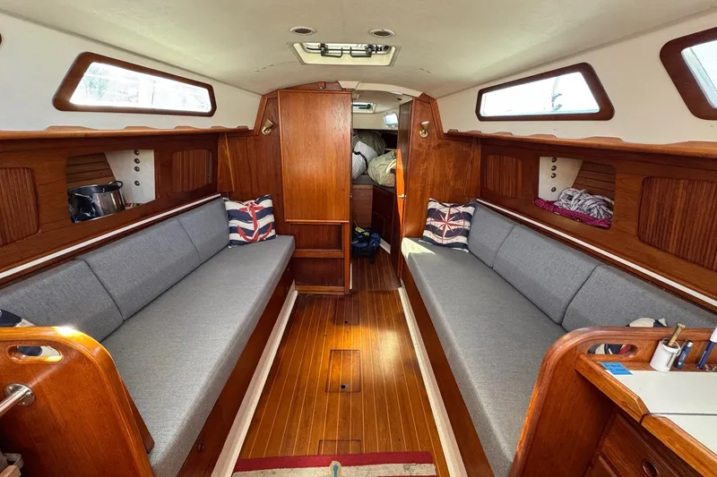 Slide: The Image of Interior of 1989 Sabre 30 MKIII sailboat with wooden finish and gray seating. - 27