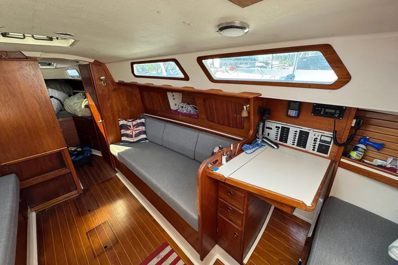 Slide: The Image of Interior of 1989 Sabre 30 MKIII sailboat with wooden furnishings and navigation station. - 29