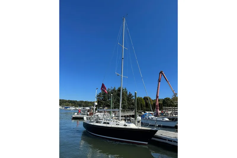 Slide: The Image of 1989 Sabre 30 MKIII sailboat docked at marina under clear blue sky. - 3
