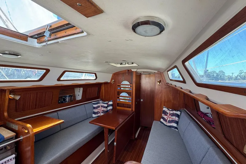 Slide: The Image of Interior of 1989 Sabre 30 MKIII sailboat with wooden finish and cozy seating. - 36