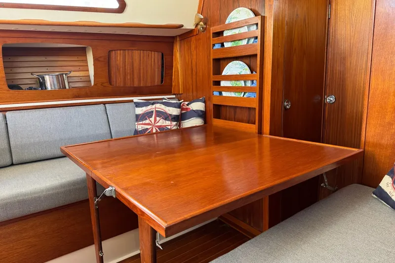 Slide: The Image of Interior of 1989 Sabre 30 MKIII sailboat with wooden table and seating area. - 39