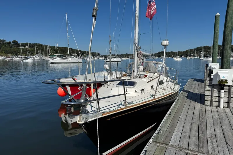 Slide: The Image of 1989 Sabre 30 MKIII sailboat docked at a marina on a sunny day. - 4