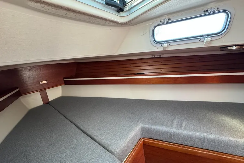 Slide: The Image of Interior cabin of 1989 Sabre 30 MKIII sailboat with wooden accents and gray upholstery. - 40