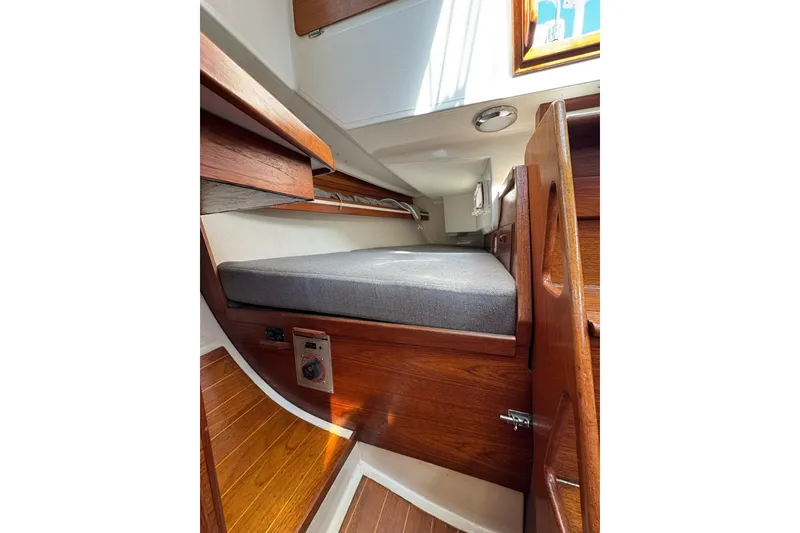 Slide: The Image of Interior cabin of 1989 Sabre 30 MKIII sailboat with wooden finish and cushioned berth. - 48