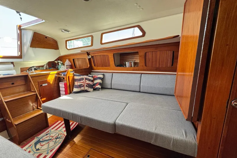 Slide: The Image of Interior of 1989 Sabre 30 MKIII sailboat with wooden finish and gray seating. - 50