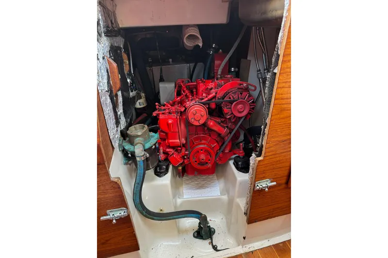 Slide: The Image of Engine compartment of a 1989 Sabre 30 MKIII sailboat, featuring a red engine. - 51