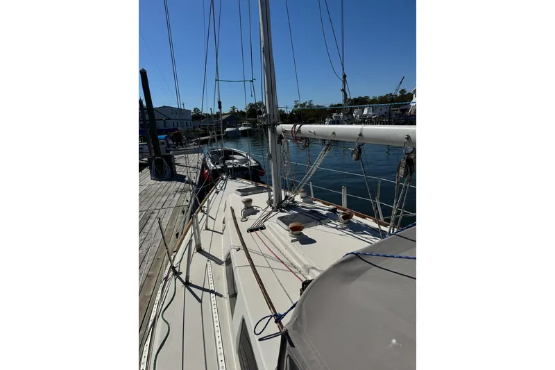 Slide: The Image of 1989 Sabre 30 MKIII sailboat docked at marina under clear blue sky. - 9