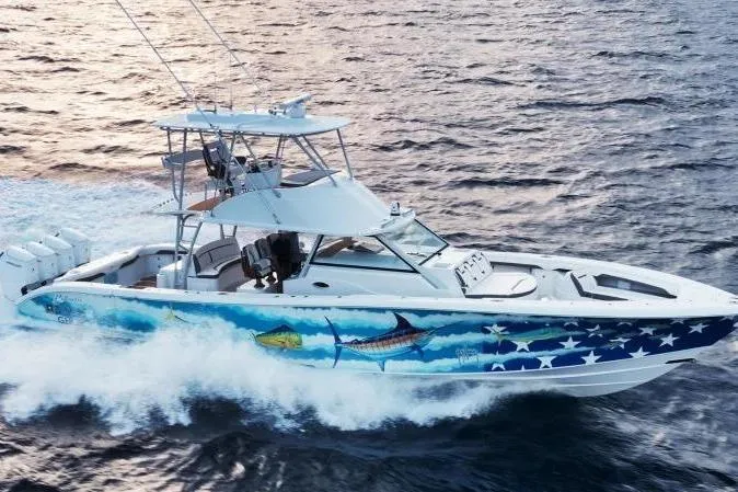 The Image of 2022 Yellowfin 54 Offshore boat cruising on ocean with vibrant marine graphics. - 1