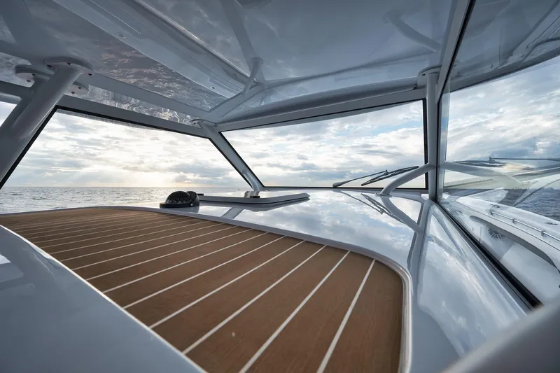 Slide: The Image of 2022 Yellowfin 54 Offshore boat with sleek deck and ocean view. - 14