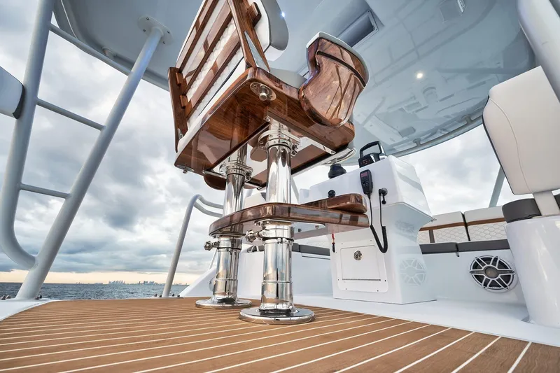 Slide: The Image of Luxurious interior of 2022 Yellowfin 54 Offshore boat with polished wood and chrome accents. - 17