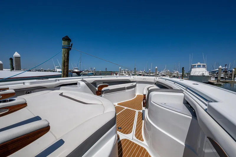 Slide: The Image of 2022 Yellowfin 54 Offshore boat docked at marina, featuring sleek design and spacious deck. - 21