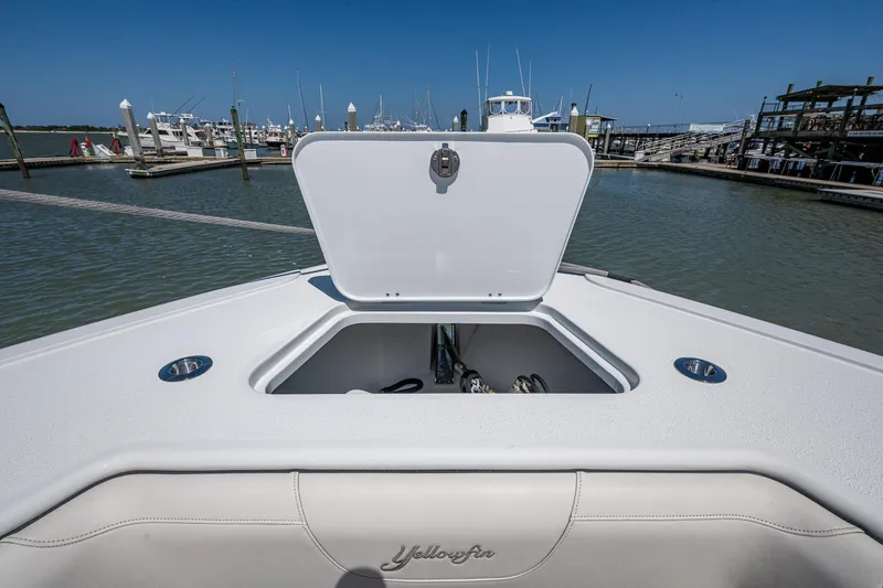 Slide: The Image of 2022 Yellowfin 54 Offshore boat with open storage compartment at marina. - 27