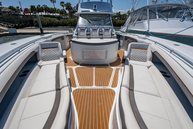 Slide: The Image of 2022 Yellowfin 54 Offshore boat interior with luxurious seating and teak flooring. - 31
