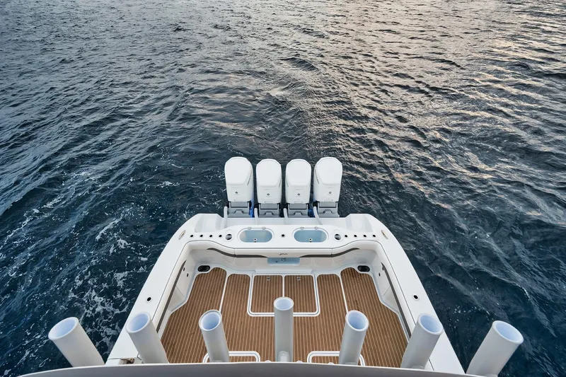Slide: The Image of 2022 Yellowfin 54 Offshore boat with quad engines on open water. - 5