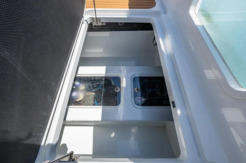 Slide: The Image of Open storage compartment on 2022 Yellowfin 54 Offshore boat, showcasing interior details. - 54