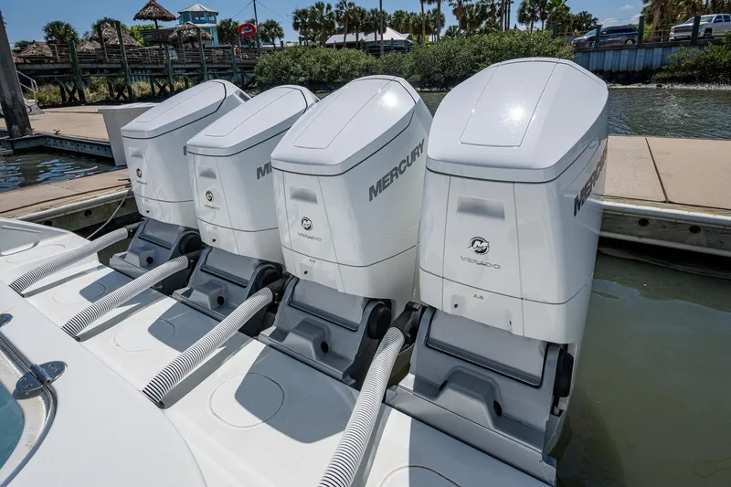 Slide: The Image of 2022 Yellowfin 54 Offshore boat with four Mercury Verado outboard engines at dock. - 62