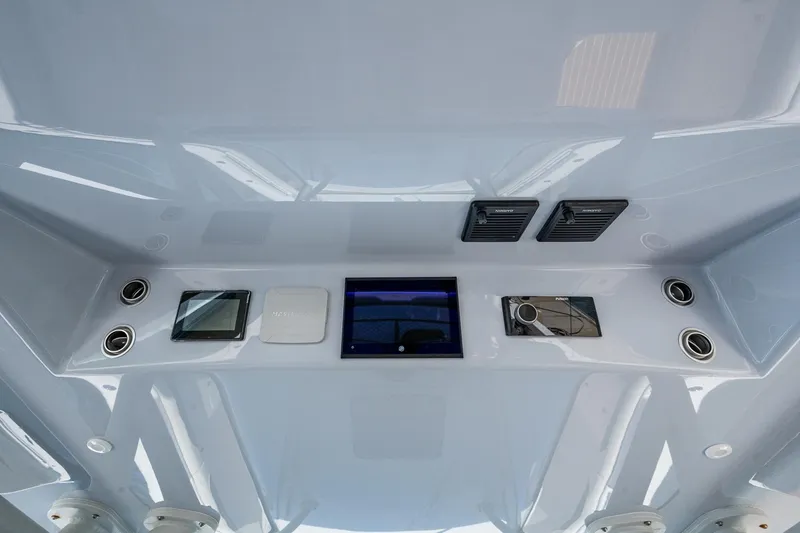 Slide: The Image of 2022 Yellowfin 54 Offshore boat dashboard with modern controls and displays. - 67