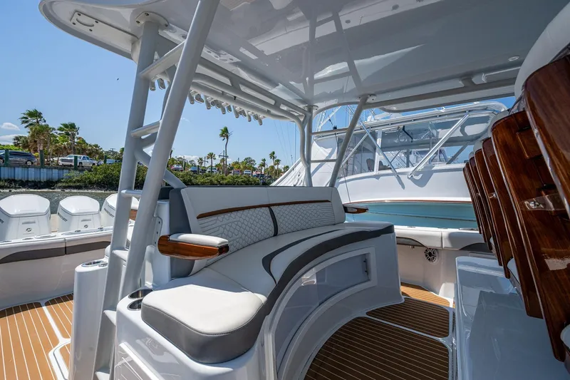 Slide: The Image of 2022 Yellowfin 54 Offshore boat interior with luxurious seating and sleek design. - 68