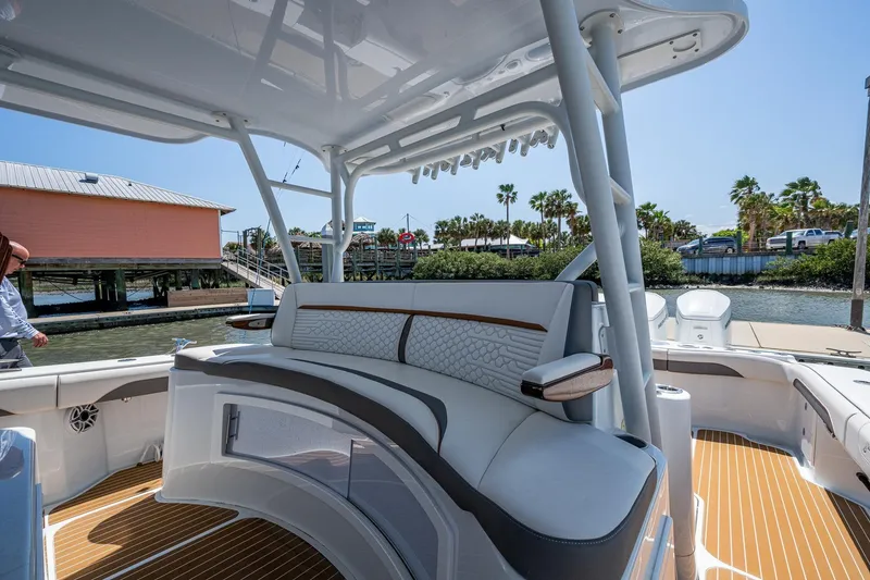 Slide: The Image of 2022 Yellowfin 54 Offshore boat interior with luxurious seating and modern design. - 70