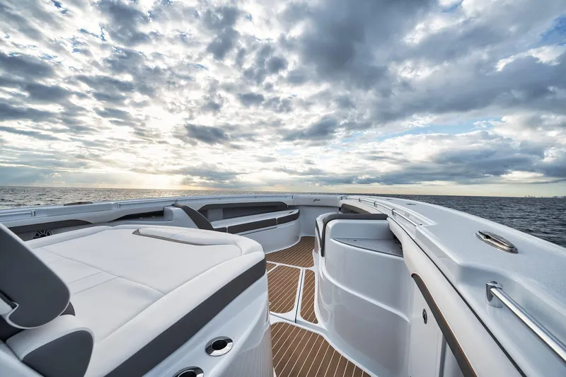 Slide: The Image of 2022 Yellowfin 54 Offshore boat deck with ocean view and dramatic cloudy sky. - 8