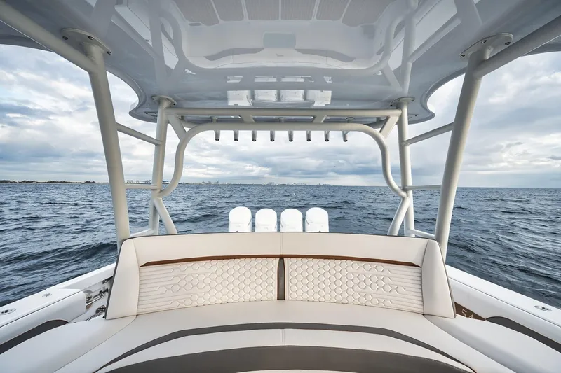 Slide: The Image of 2022 Yellowfin 54 Offshore boat interior with ocean view, featuring elegant seating and sturdy structure. - 9