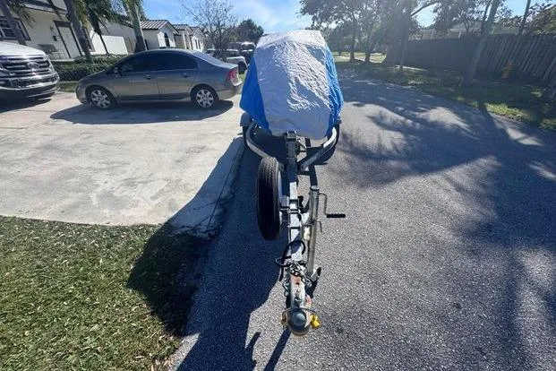 Slide: The Image of Covered 2018 Yamaha WaveRunner EX Deluxe on trailer in residential driveway. - 33