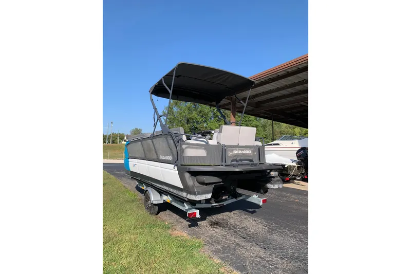Slide: The Image of 2023 Seadoo Switch Cruise 21 boat on trailer under clear blue sky. - 3