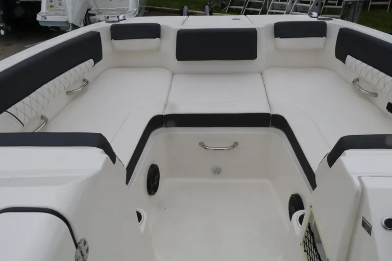 Slide: The Image of 2022 Bayliner DX 2200 boat interior with spacious seating and modern design. - 12