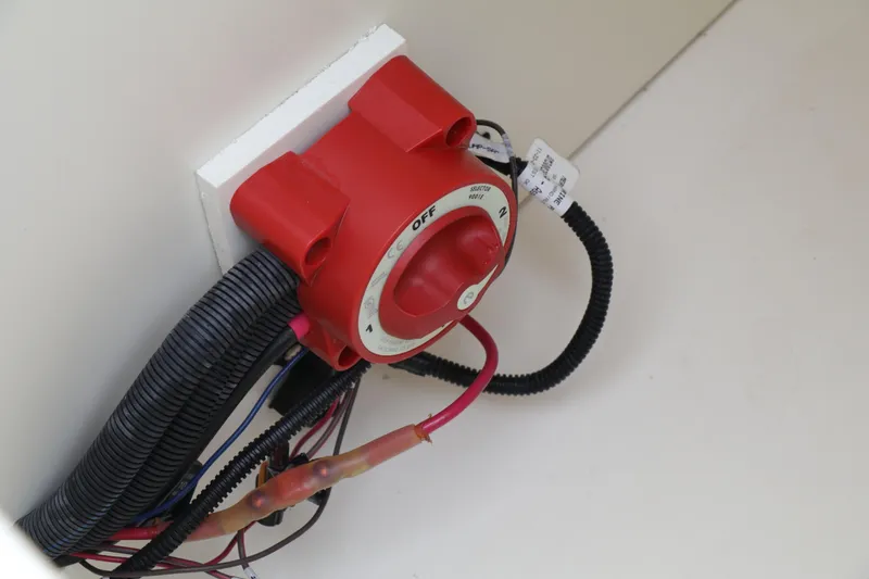 Slide: The Image of Red battery switch in a 2022 Bayliner DX 2200 boat. - 20