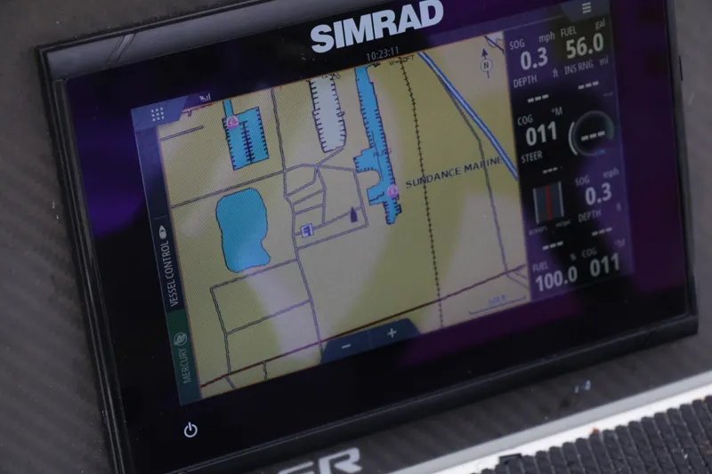 Slide: The Image of Simrad navigation display on 2022 Bayliner DX 2200 boat, showing map and vessel data. - 6