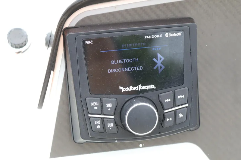 Slide: The Image of Rockford Fosgate Bluetooth stereo system on 2022 Bayliner DX 2200 boat dashboard. - 7