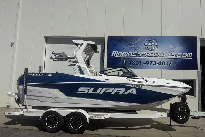 The Image of 2025 Supra SV 575 boat on trailer outside Marine Products store. - 0