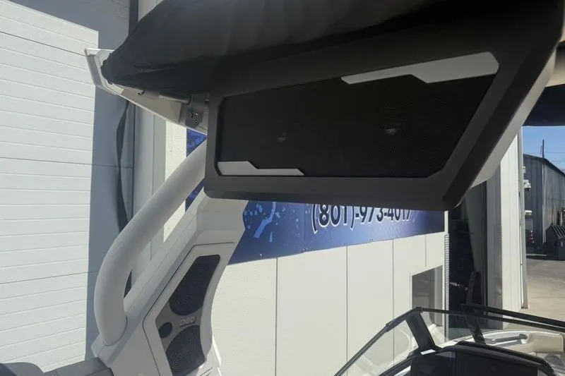 Slide: The Image of 2025 Supra SV 575 boat with advanced speaker system and sleek design. - 10