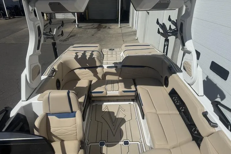 Slide: The Image of 2025 Supra SV 575 boat interior with beige seating and modern design. - 5