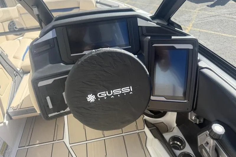 Slide: The Image of 2025 Supra SV 575 dashboard with Gussi Italia steering wheel cover and digital displays. - 6