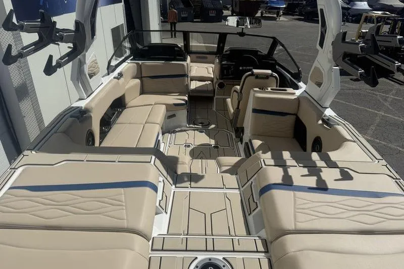 Slide: The Image of 2025 Supra SV 575 boat interior with beige seating and modern design. - 8