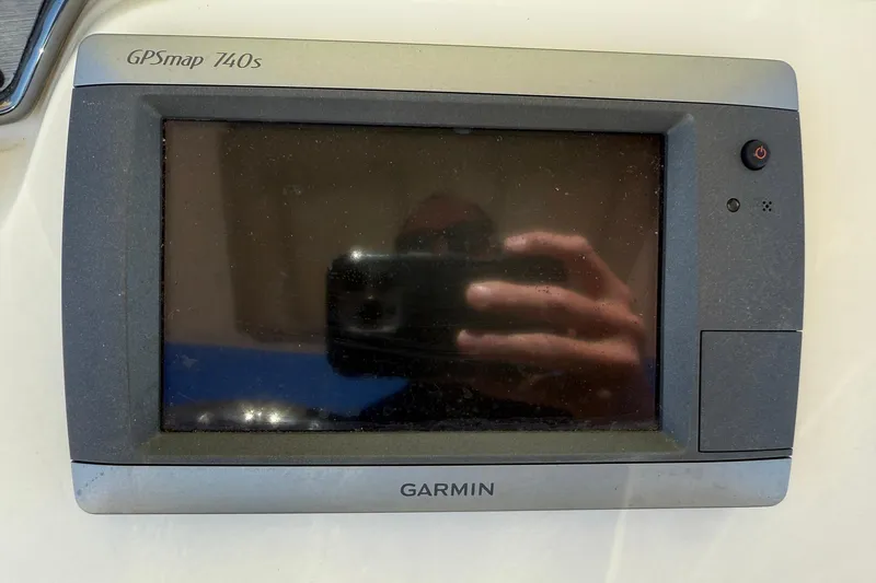 Slide: The Image of Garmin GPSmap 740s device on 2012 Scout 240 Bay Scout boat dashboard. - 17