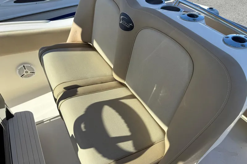 Slide: The Image of 2012 Scout 240 Bay Scout boat seat with cup holders and speaker. - 23